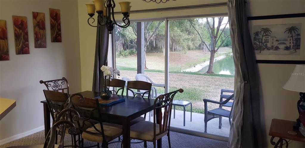 8521 Crystal Cove Loop Kissimmee, FL 34747 - Photo 3 of 23 a view of a dining room with furniture window and outside view