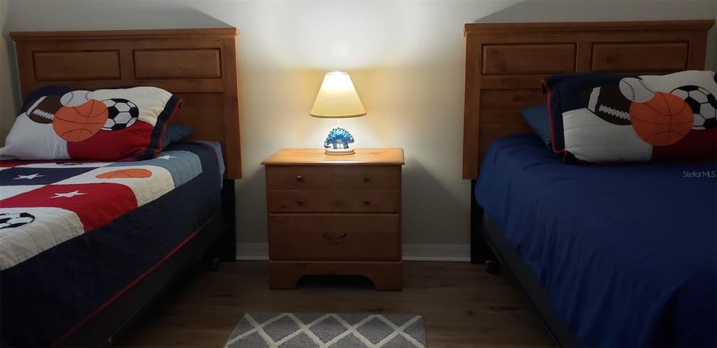 8521 Crystal Cove Loop Kissimmee, FL 34747 - Photo 8 of 23 a bedroom with a bed and a closet