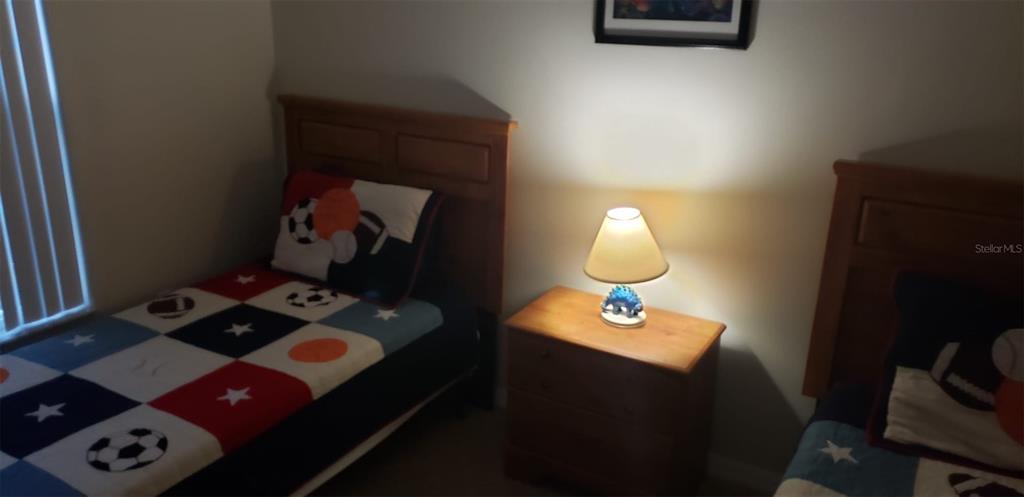 8521 Crystal Cove Loop Kissimmee, FL 34747 - Photo 10 of 23 a bedroom with a bed