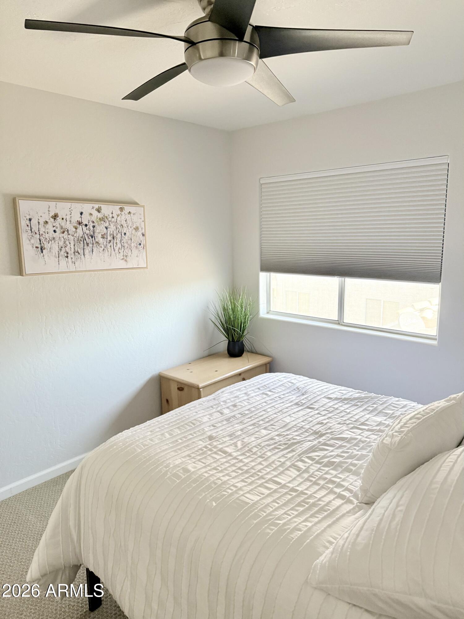 3426 East Clark Road Phoenix, AZ 85050 - Photo 34 of 48 a bedroom with a bed and a window