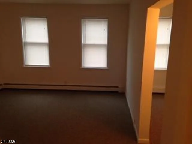 a view of a room that has a window in it