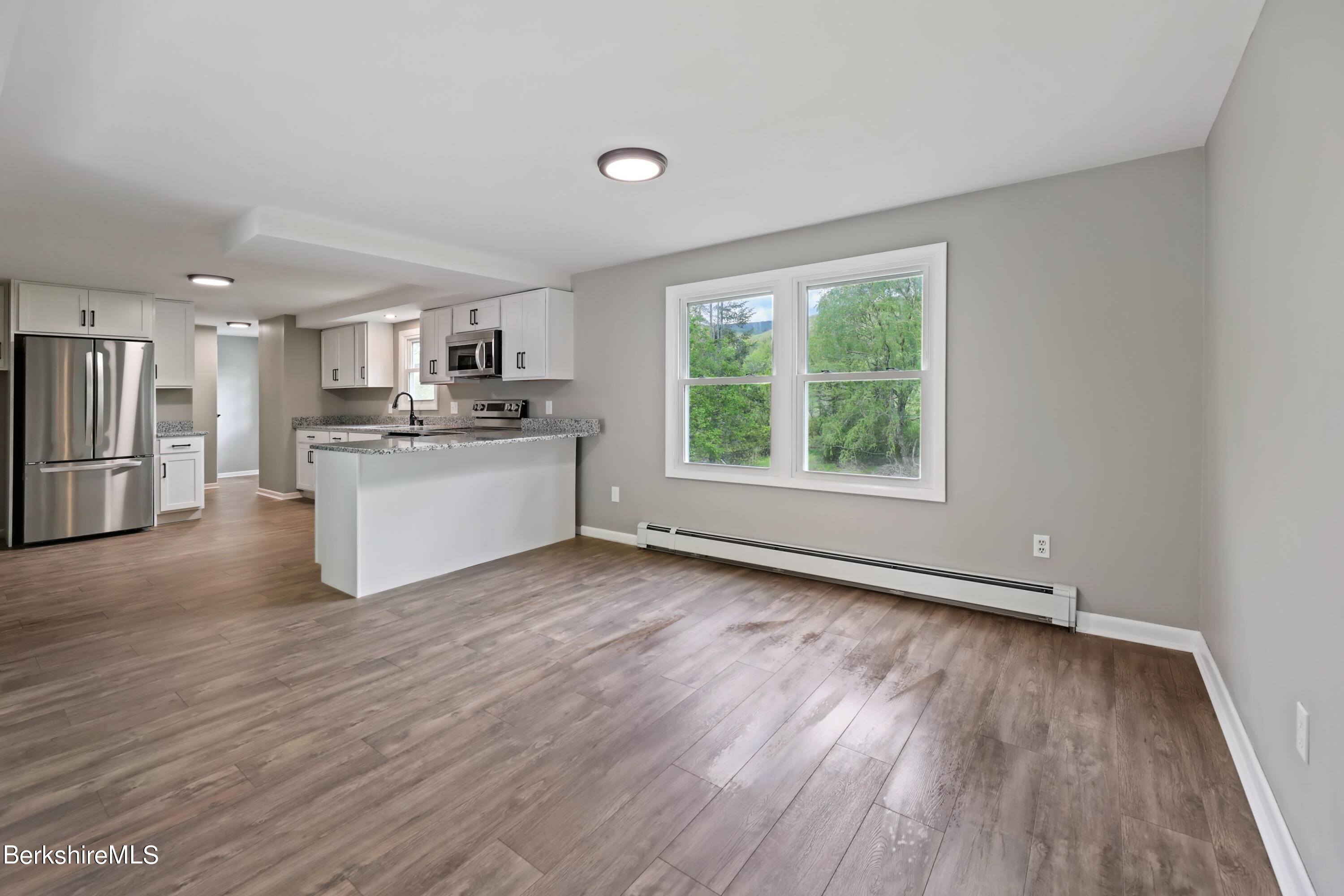 87 East Road Adams, MA 01220 - Photo 8 of 28 a kitchen with stainless steel appliances granite countertop a stove and a refrigerator