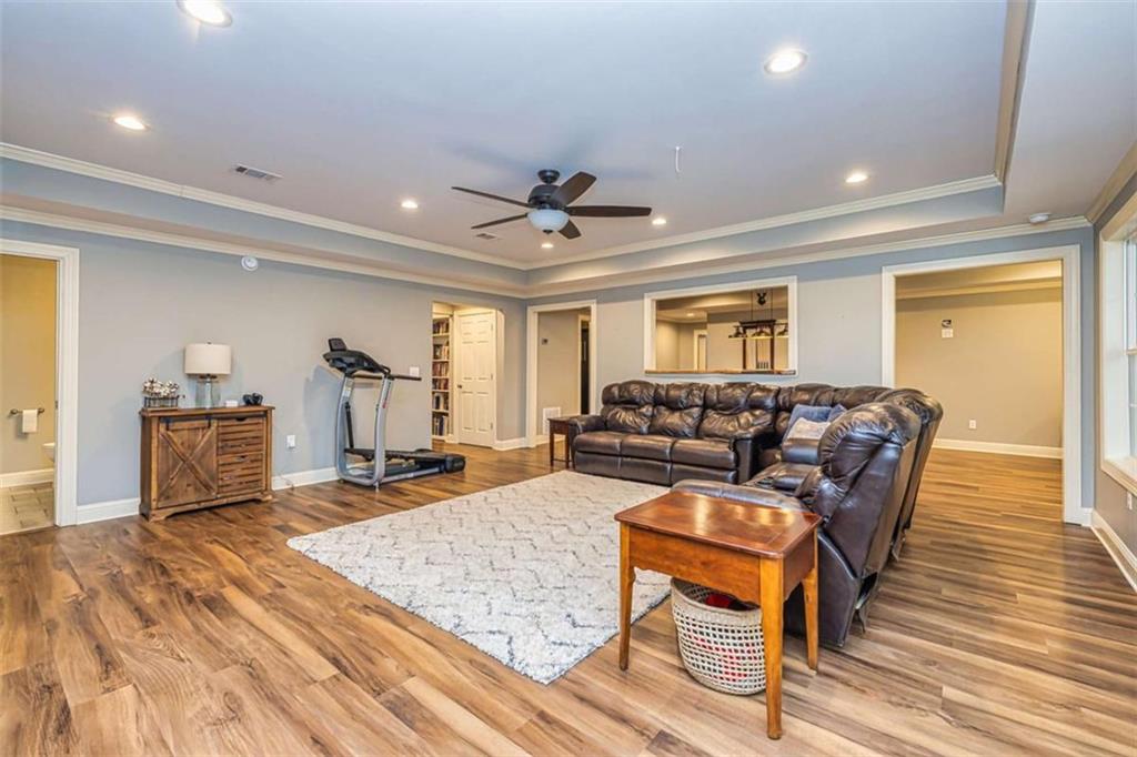 20 Jasmine Court Newnan, GA 30265 - Photo 41 of 72 a living room with furniture and a wooden floor