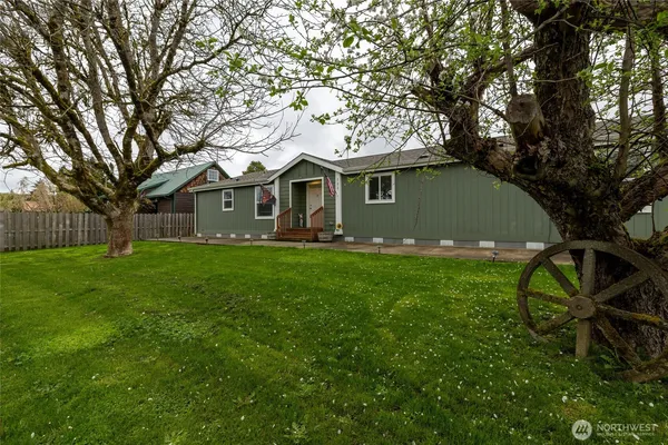 a front view of house with yard and green space