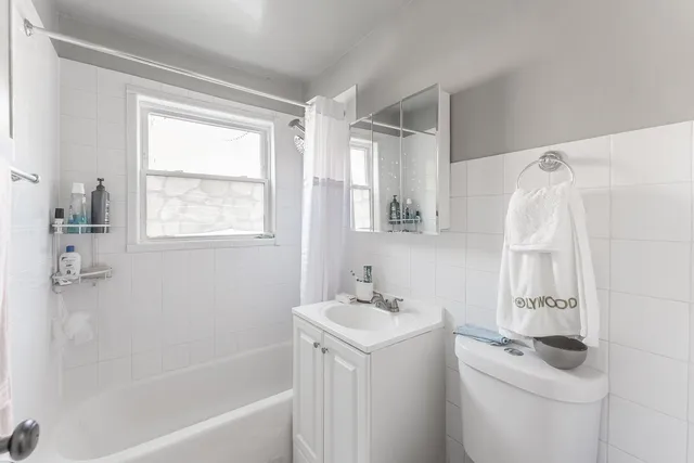 a bathroom with a sink a mirror and a bathtub
