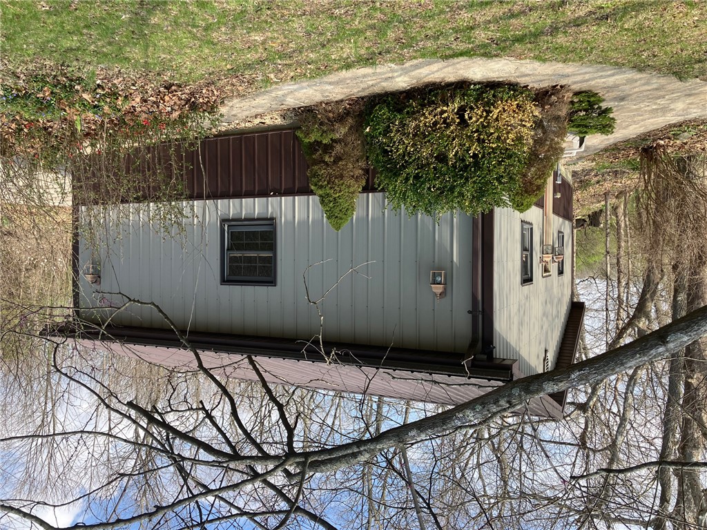 2066 Tolbert Road Hamilton, OH 45011 - Photo 34 of 63 This charming structure features durable metal siding and a sturdy roof, blending seamlessly with the natural surroundings.