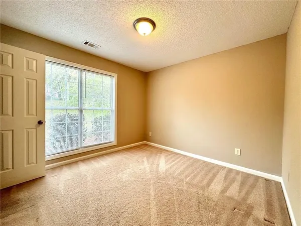 a view of a room with wooden walls