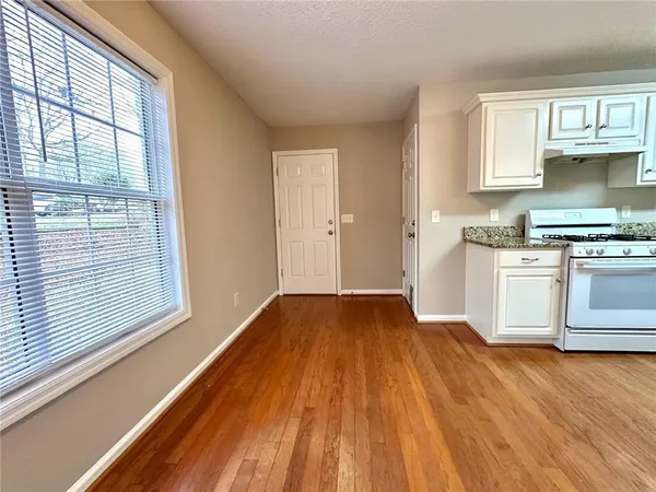 a view of livingroom with hardwood floor and a ceiling fan