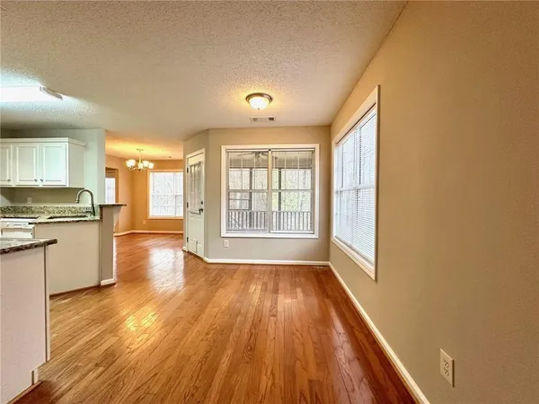 a view of a balcony with wooden floor