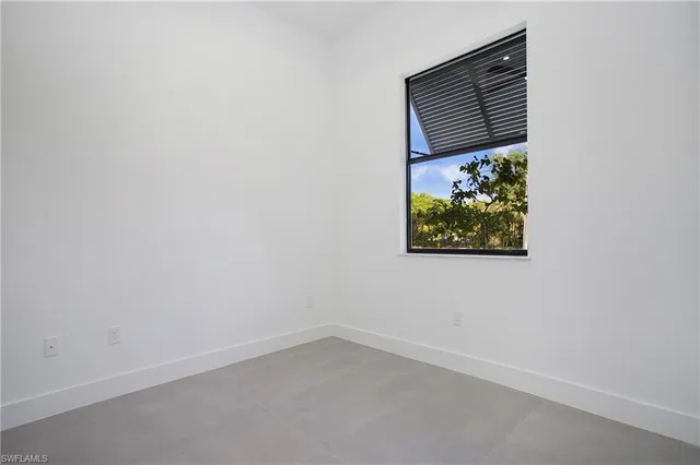 a view of a livingroom with furniture and natural light