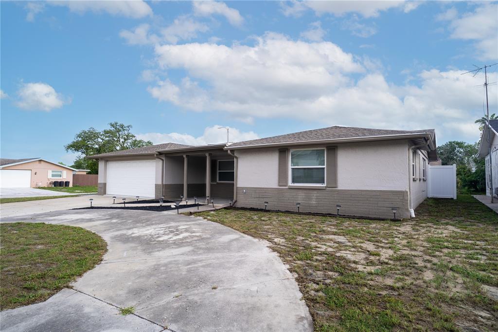 7715 Foxbloom Drive Port Richey, FL 34668 - Photo 2 of 37