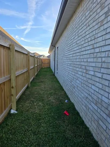 a view of an entrance to house with yard