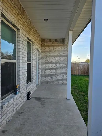 a view of a backyard with sitting area