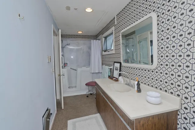 a bathroom with a sink and a mirror
