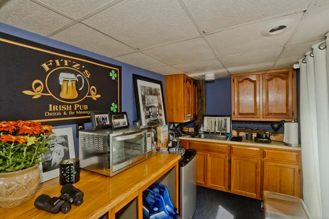 a kitchen with a sink and cabinets