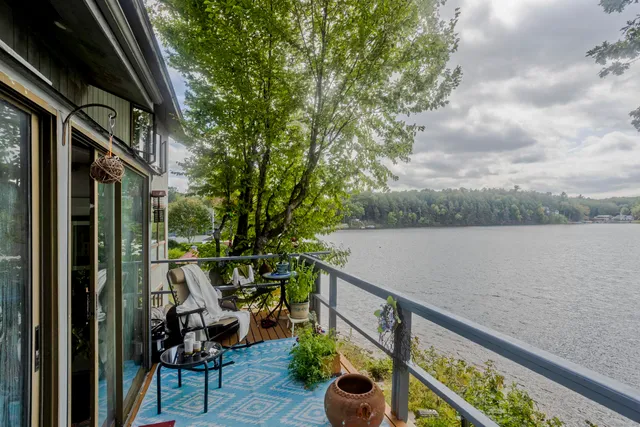 a view of balcony with furniture
