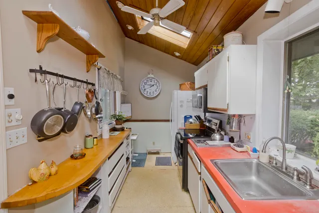 a view of a kitchen with appliances and cabinets
