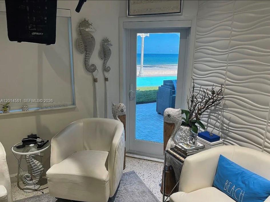 3400 North Surf Road, Unit 1 Hollywood, FL 33019 - Photo 9 of 14 a living room with furniture and a potted plant