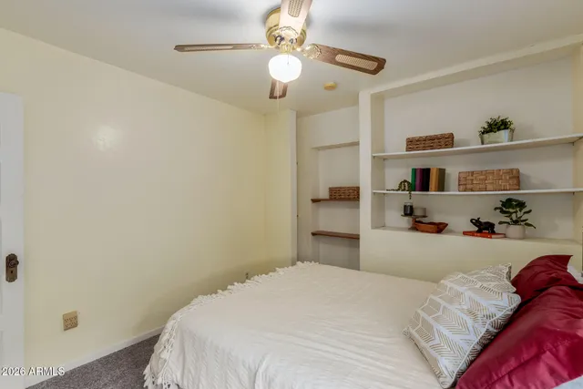 a bedroom with a bed and closet