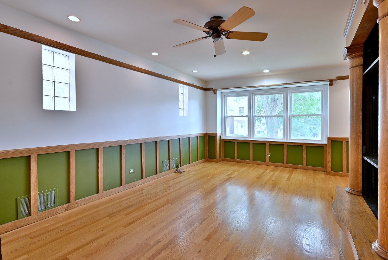 3952 North Oleander Avenue Chicago, IL 60634 - Photo 12 of 34 a view of an empty room with a window and wooden floor