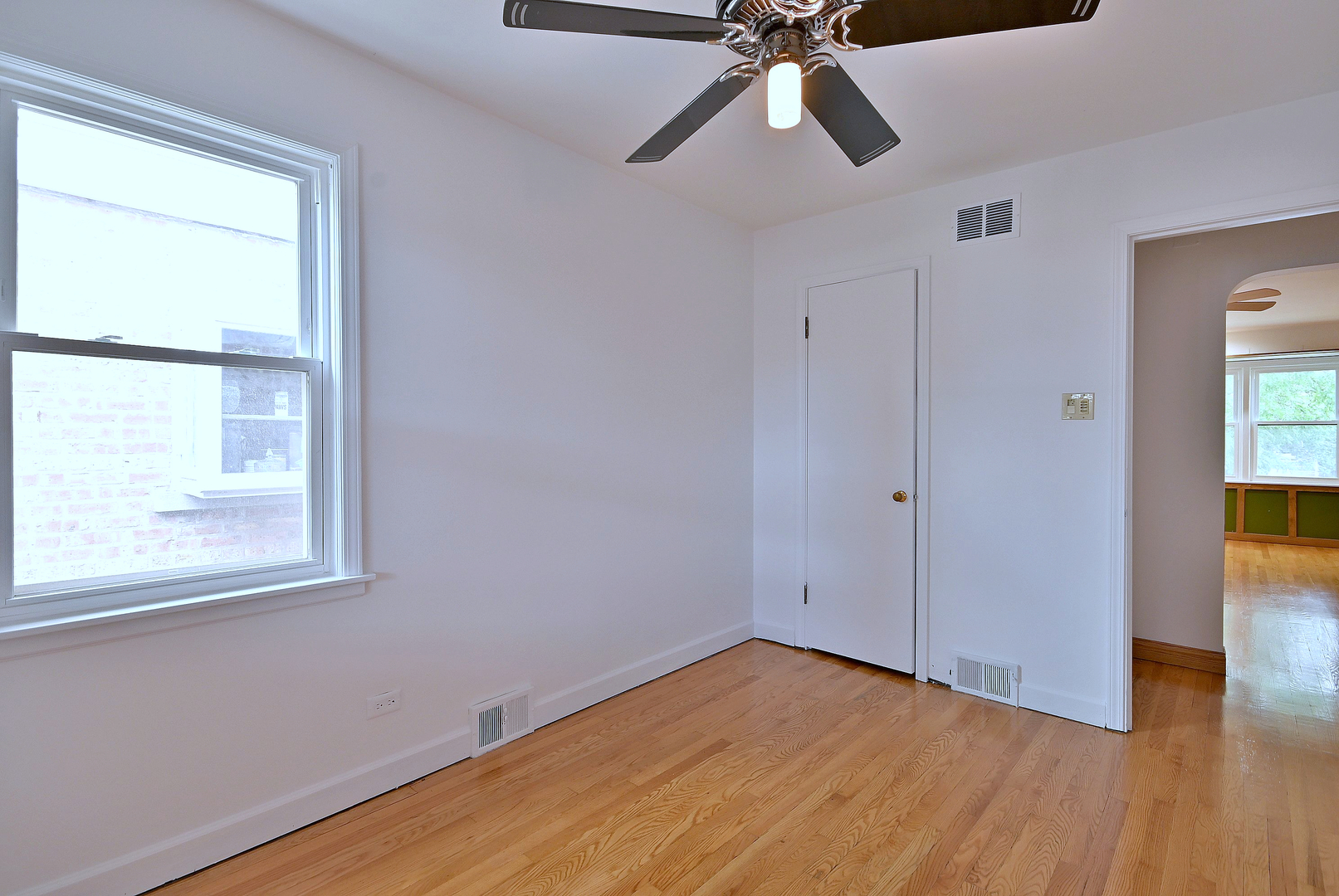 3952 North Oleander Avenue Chicago, IL 60634 - Photo 17 of 34 a view of empty room with wooden floor and fan