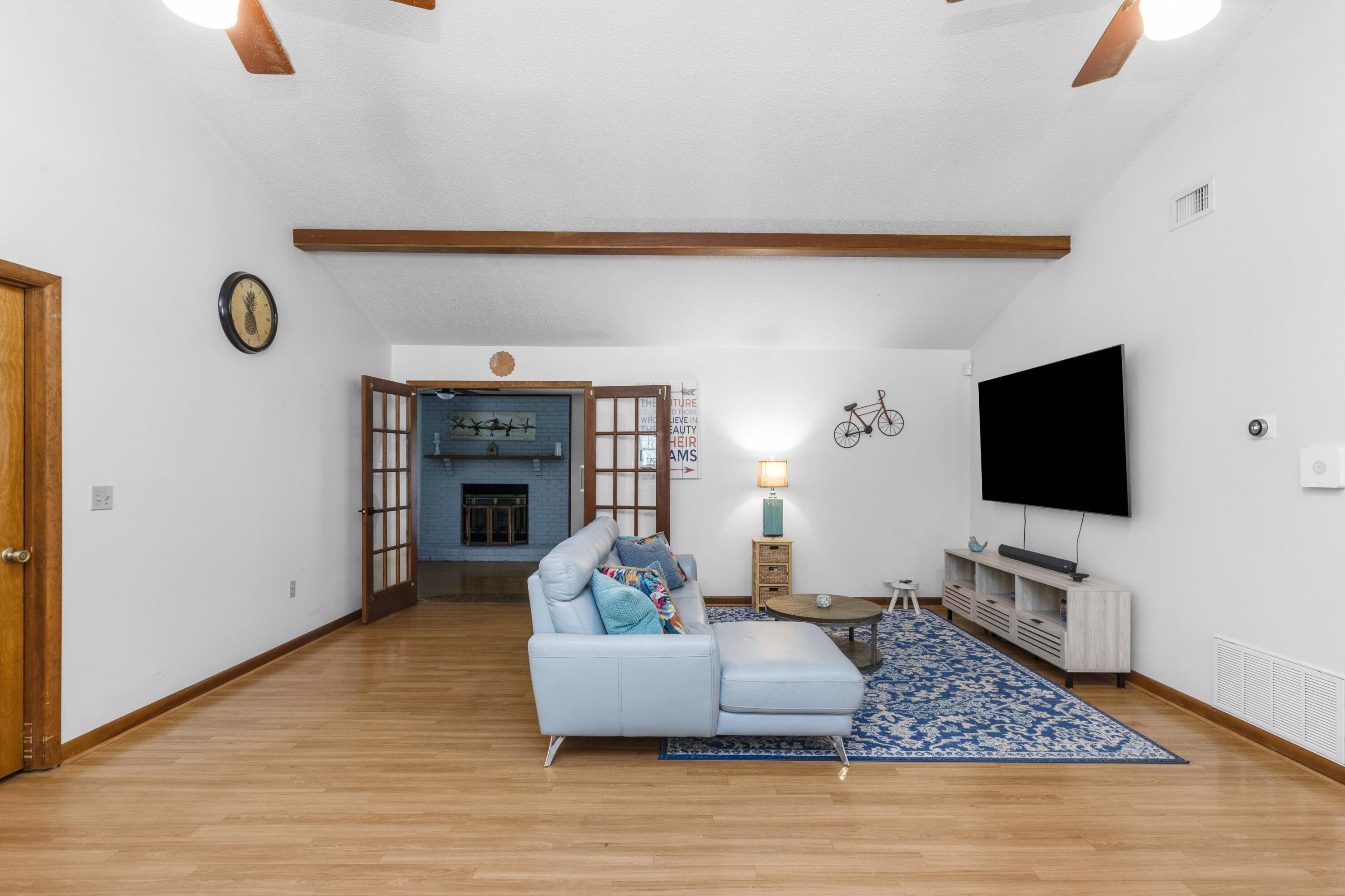 202 Wheeler Place Crestview, FL 32539 - Photo 15 of 40 a living room with furniture and a flat screen tv
