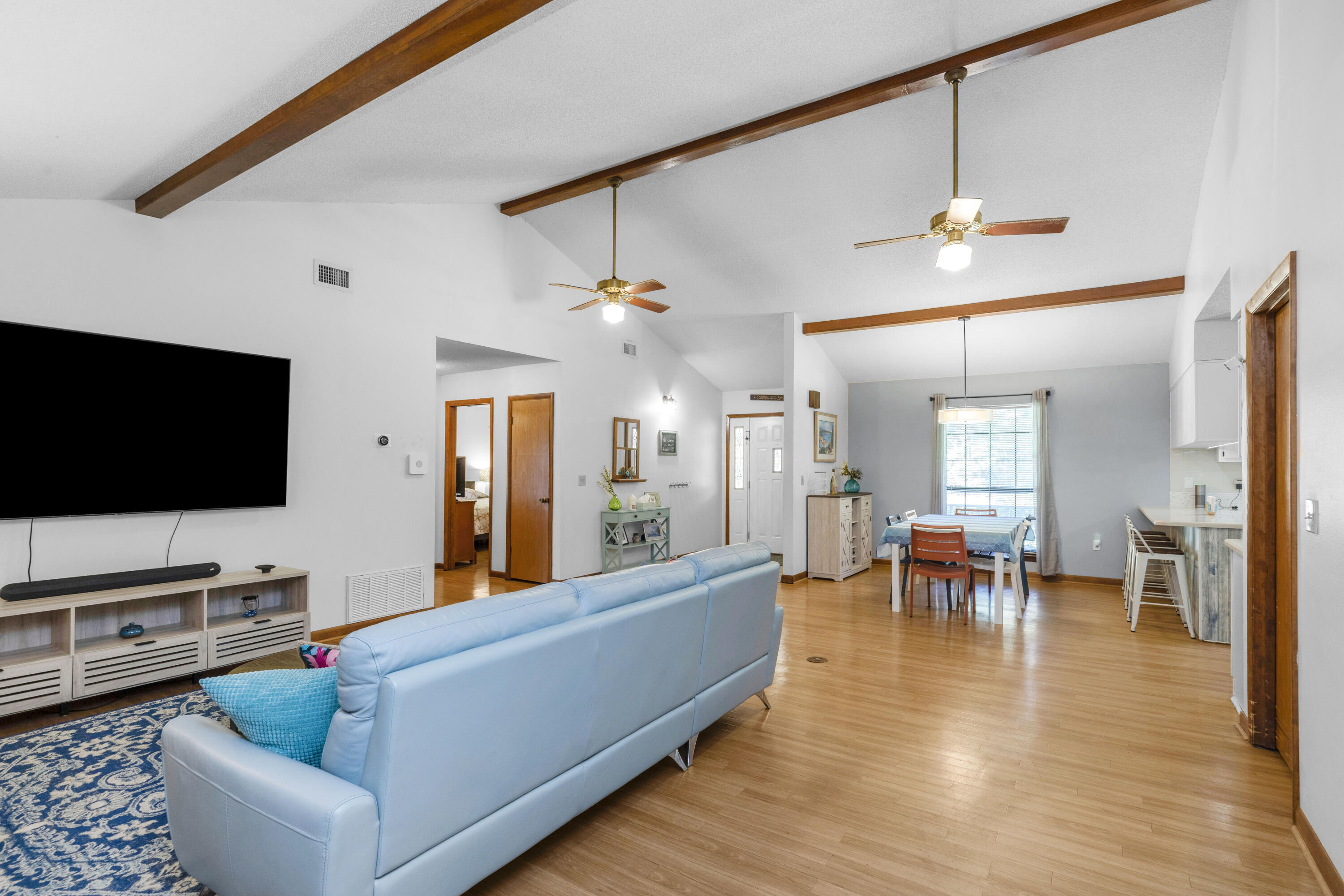 202 Wheeler Place Crestview, FL 32539 - Photo 16 of 40 a living room with furniture and a flat screen tv