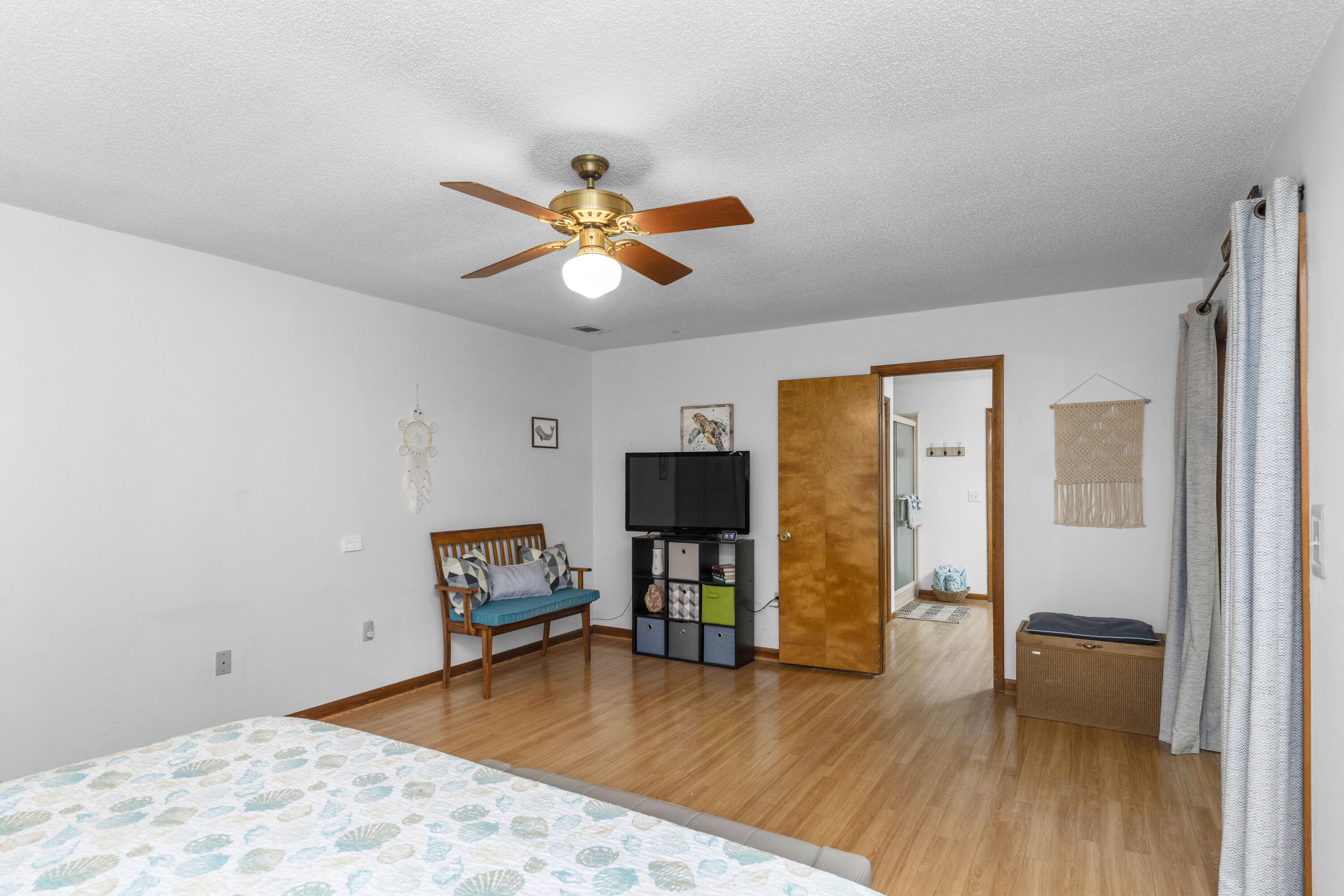 202 Wheeler Place Crestview, FL 32539 - Photo 23 of 40 a living room with furniture and a flat screen tv