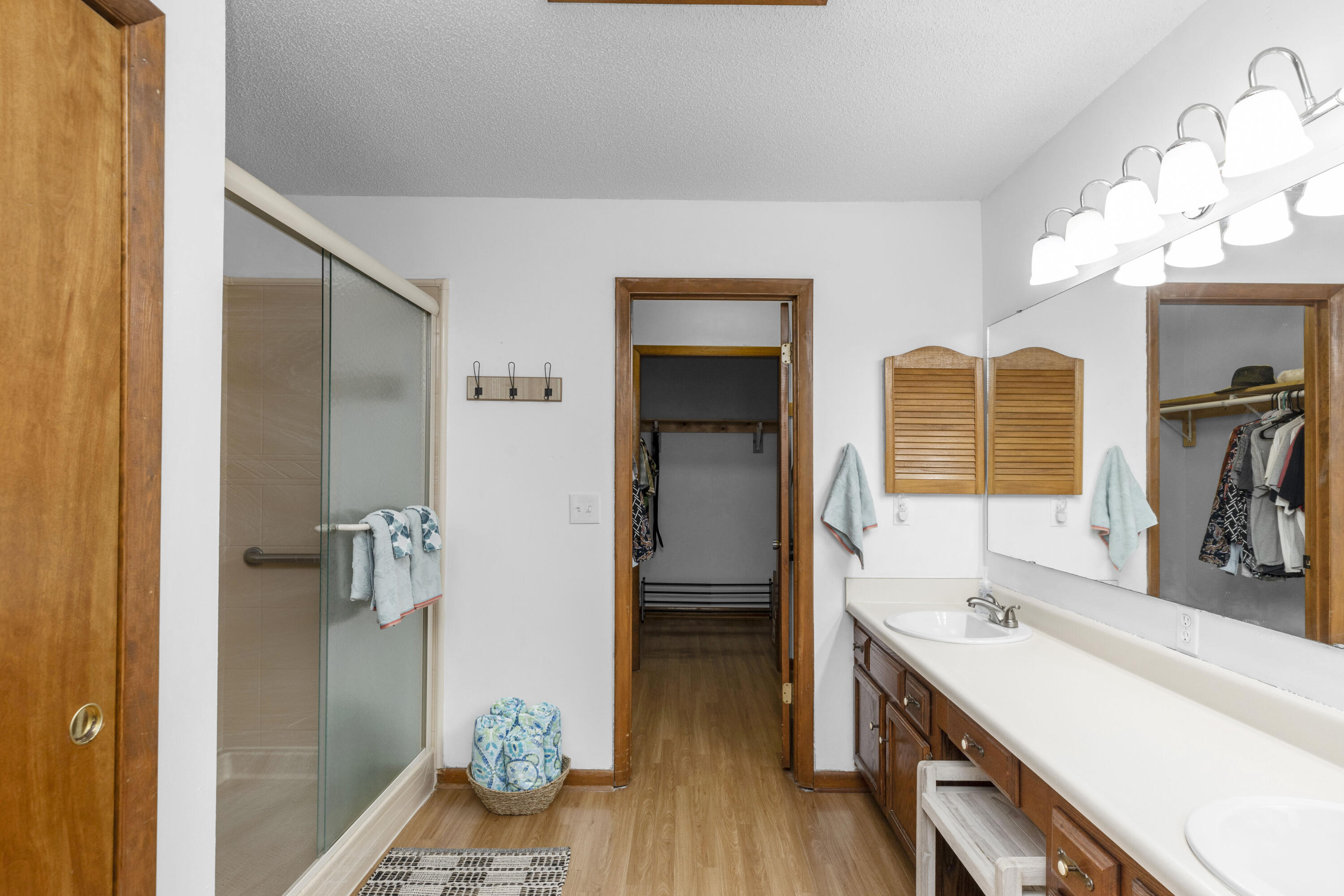 202 Wheeler Place Crestview, FL 32539 - Photo 26 of 40 a bathroom with a sink a mirror and a shower