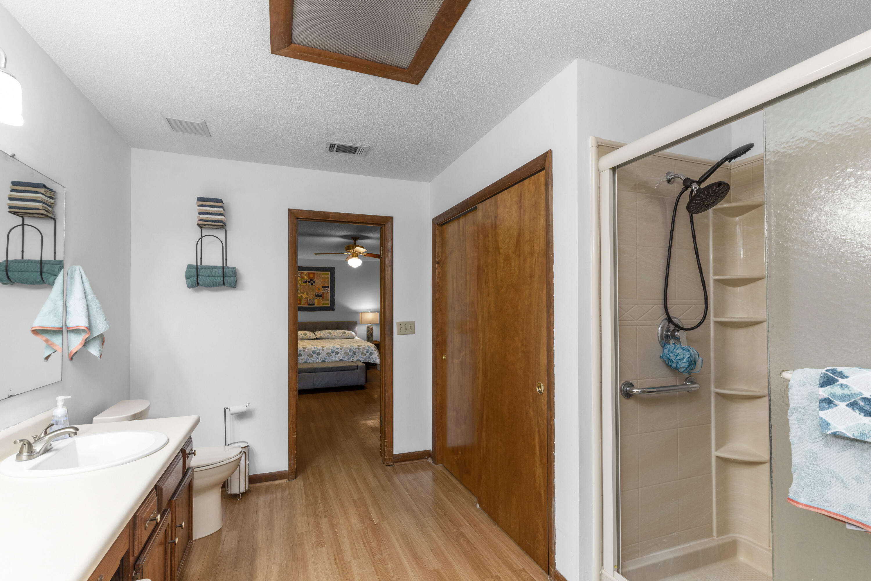 202 Wheeler Place Crestview, FL 32539 - Photo 27 of 40 a en suite bathroom with a shower a sink and a mirror