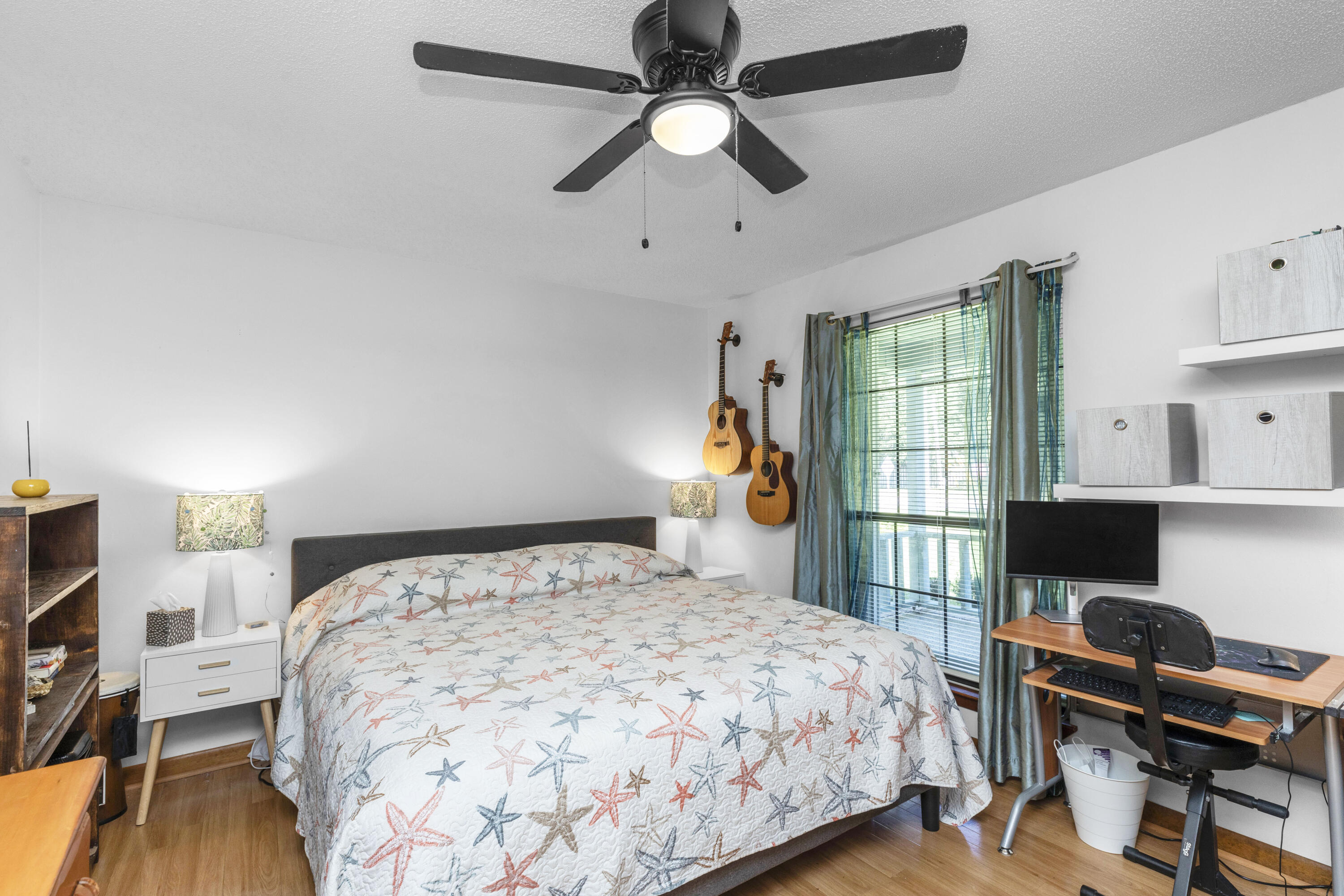 202 Wheeler Place Crestview, FL 32539 - Photo 28 of 40 a bedroom with a bed and a flat screen tv