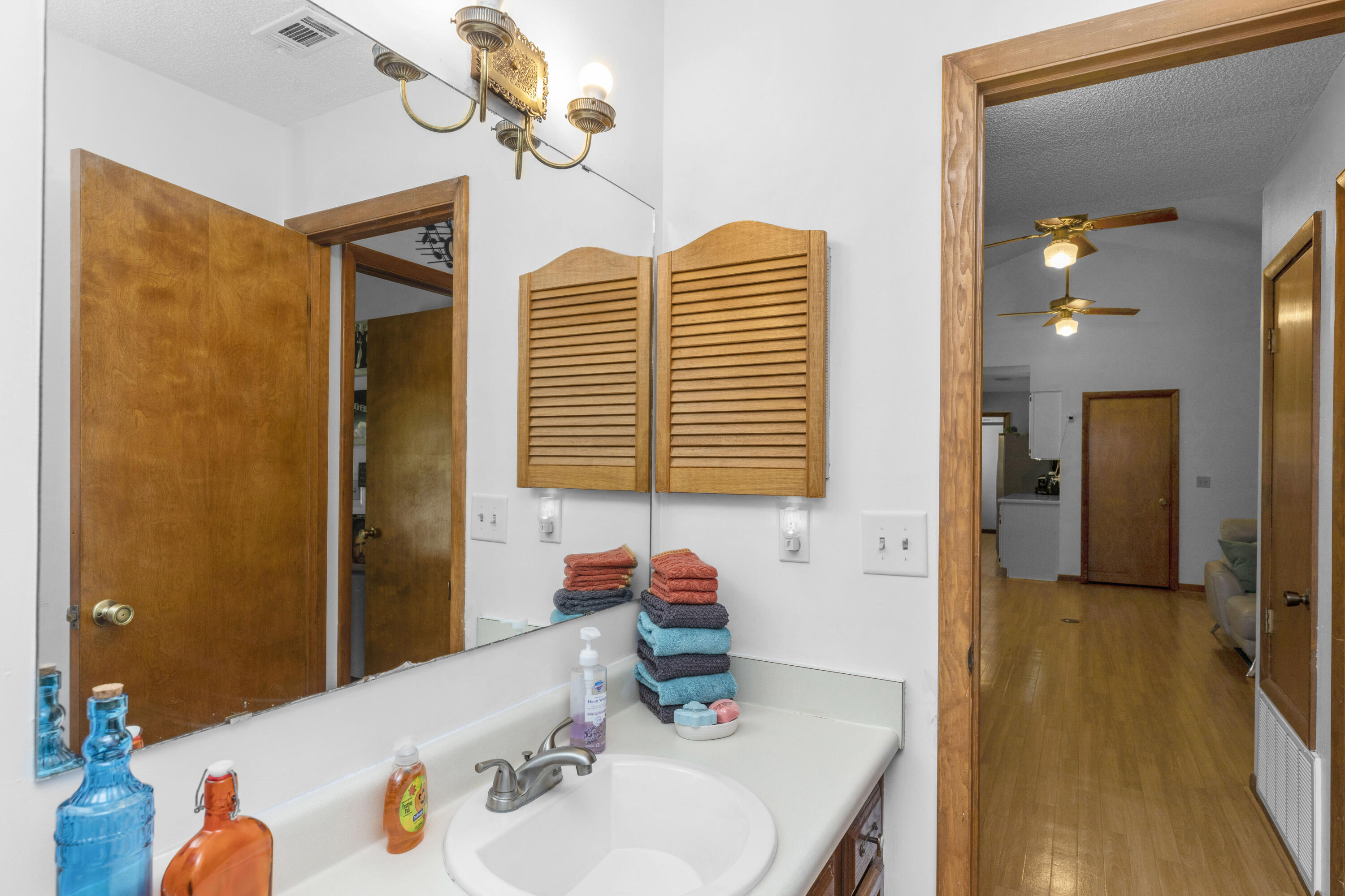 202 Wheeler Place Crestview, FL 32539 - Photo 31 of 40 a bathroom with a sink a vanity and a mirror
