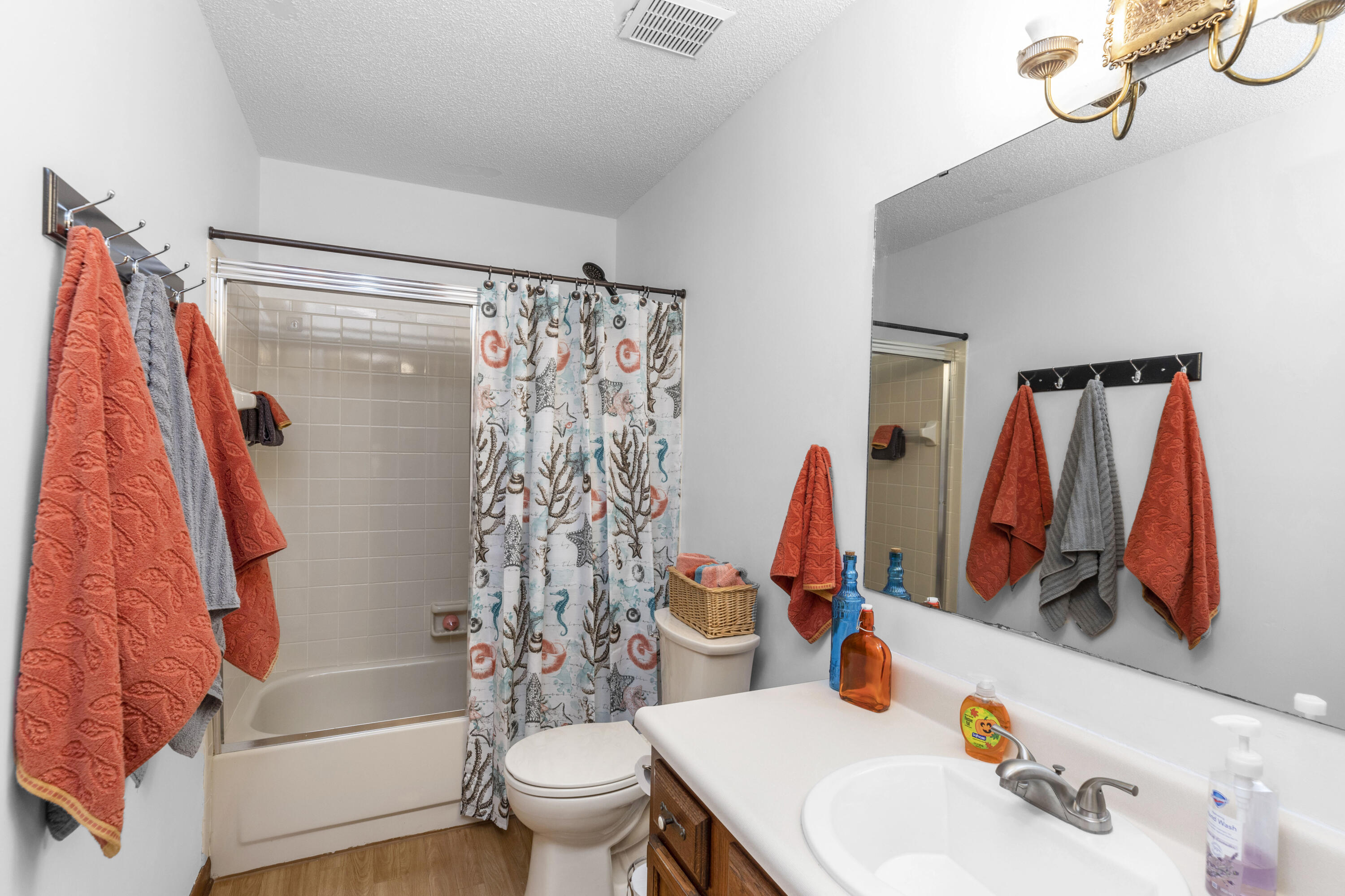 202 Wheeler Place Crestview, FL 32539 - Photo 32 of 40 a bathroom with a sink toilet and shower