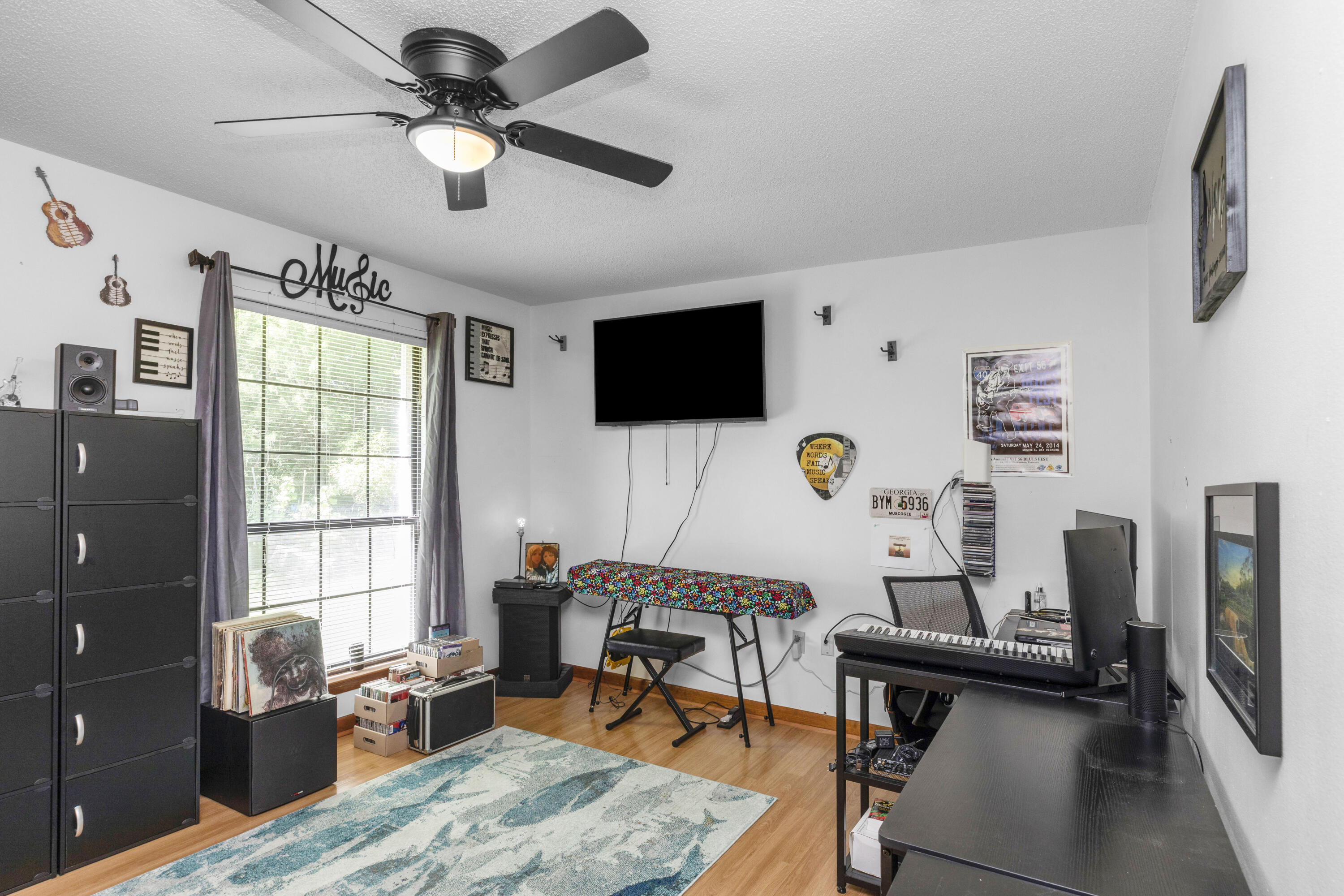 202 Wheeler Place Crestview, FL 32539 - Photo 35 of 40 a workspace with wooden floor and furniture