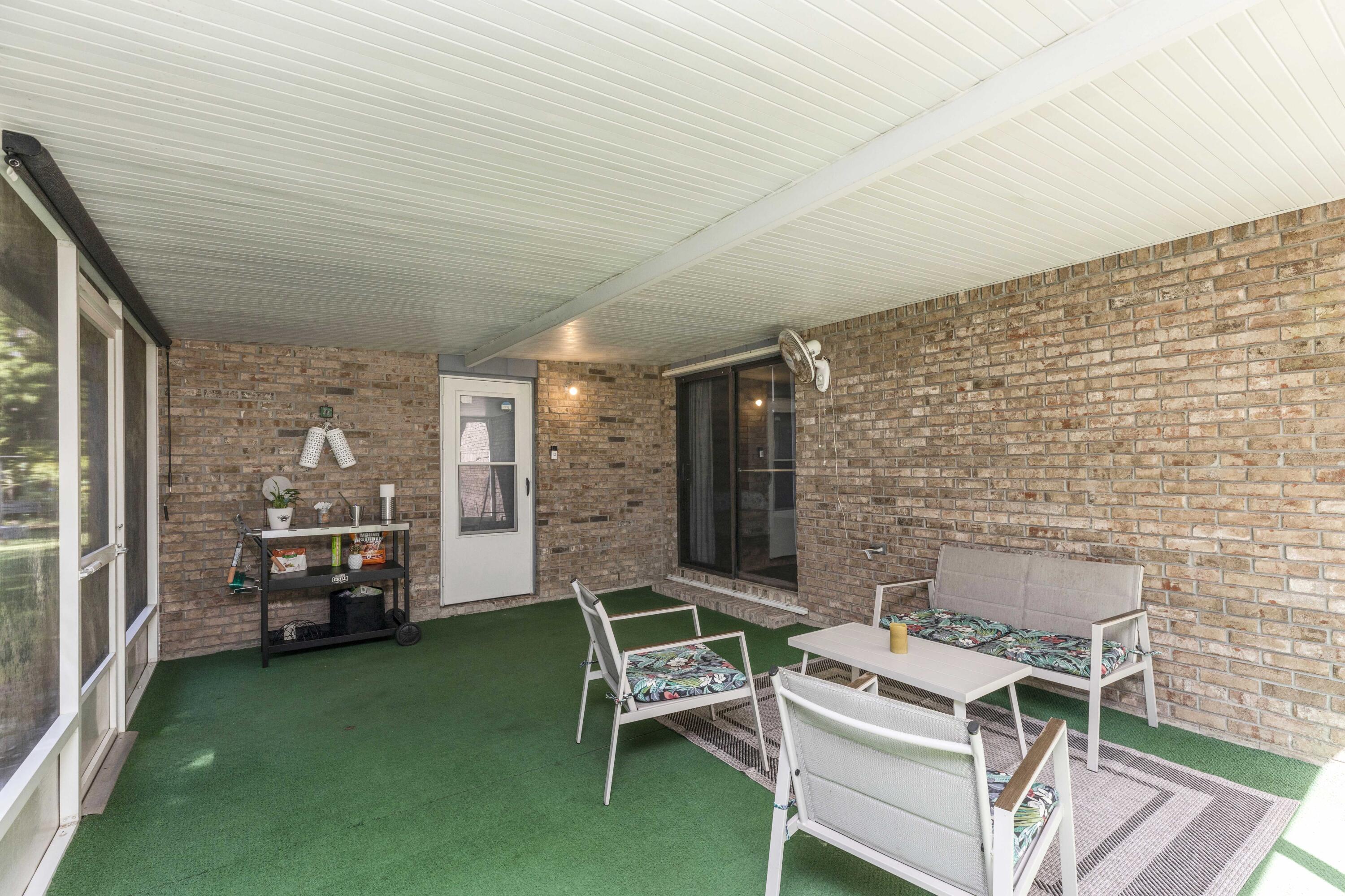 202 Wheeler Place Crestview, FL 32539 - Photo 38 of 40 a backyard of a house with barbeque oven table and chairs