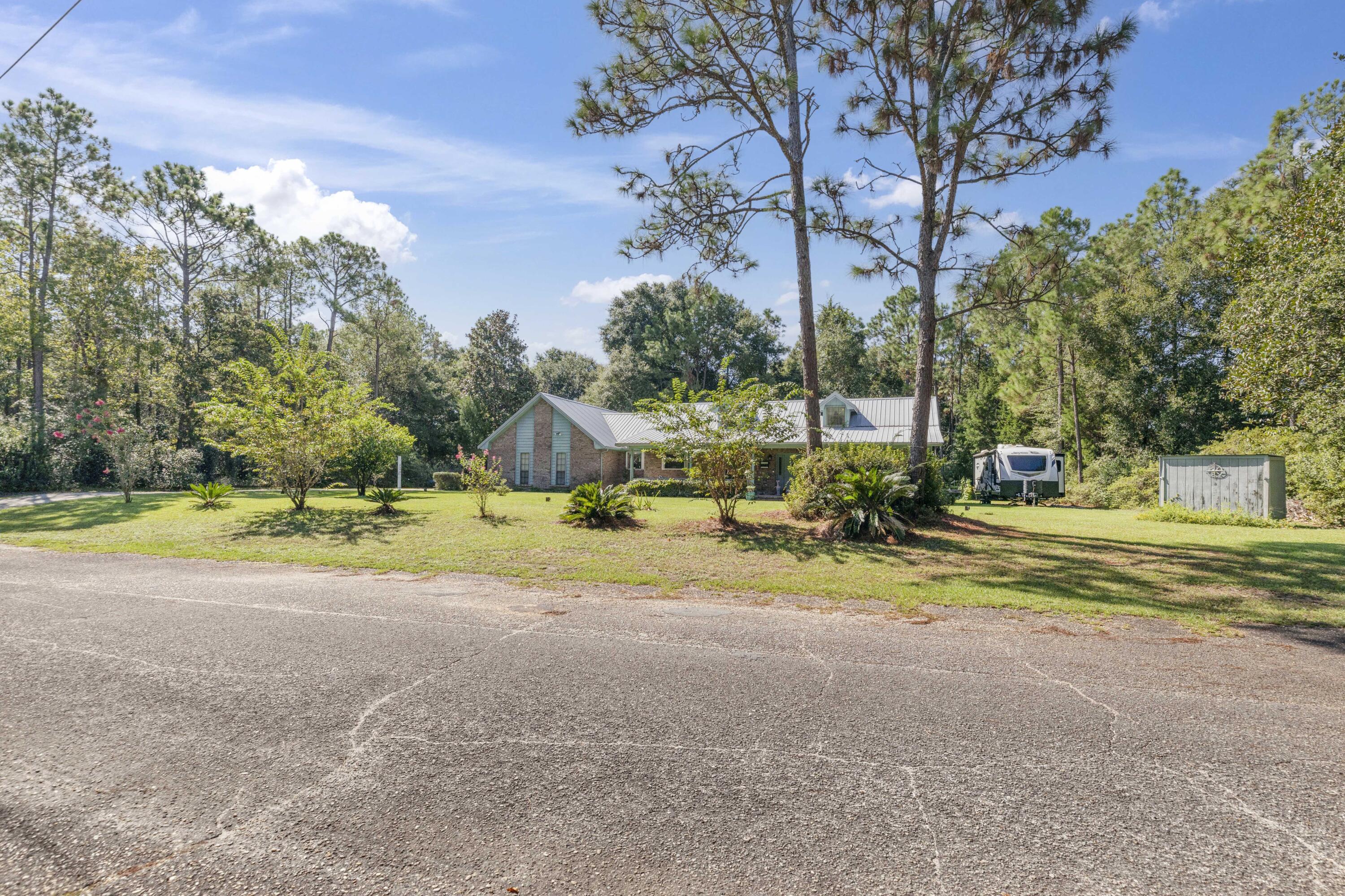 202 Wheeler Place Crestview, FL 32539 - Photo 5 of 40 a view of swimming pool with an outdoor space and seating area