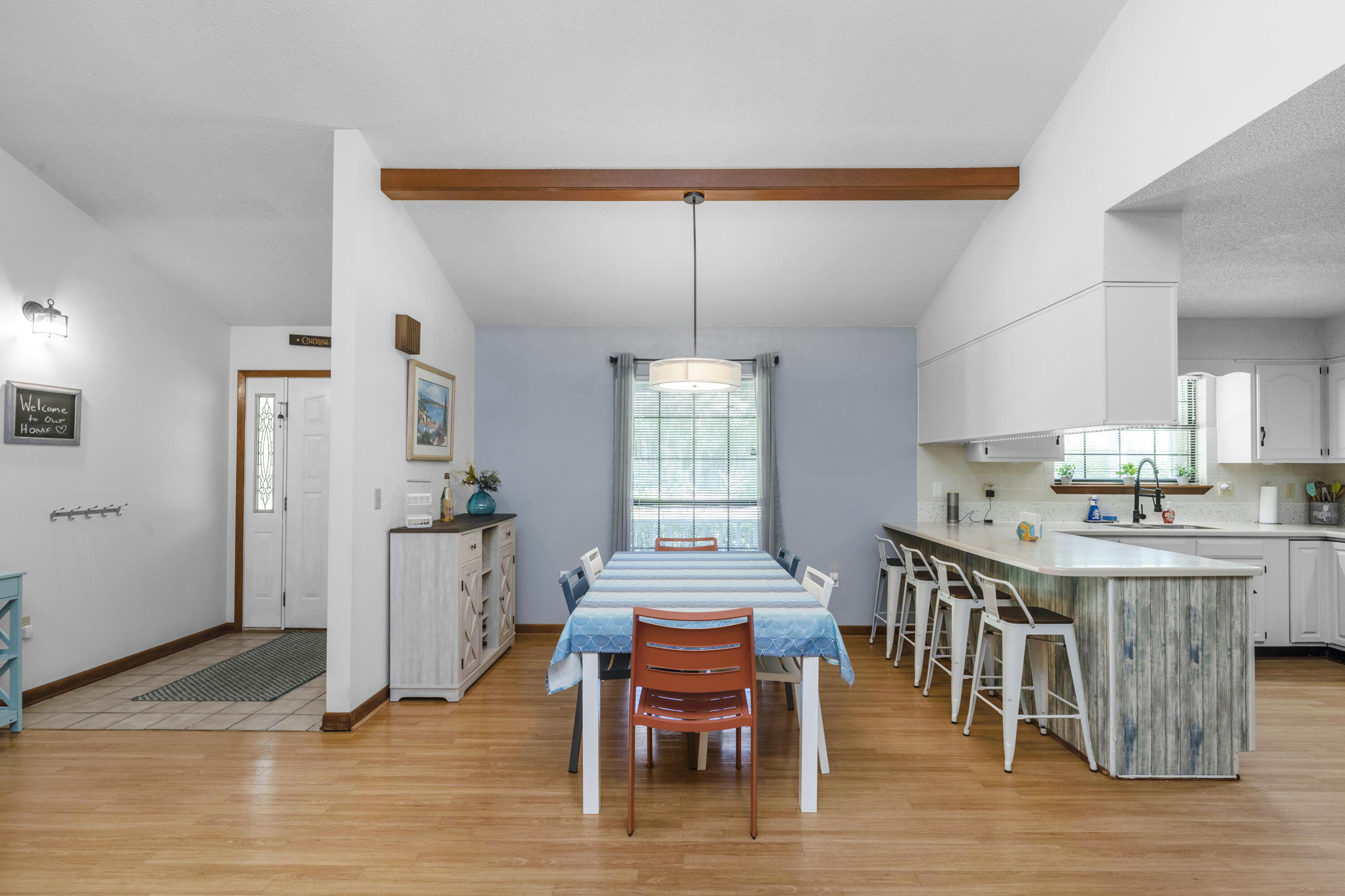 202 Wheeler Place Crestview, FL 32539 - Photo 8 of 40 a dining room with furniture and wooden floor