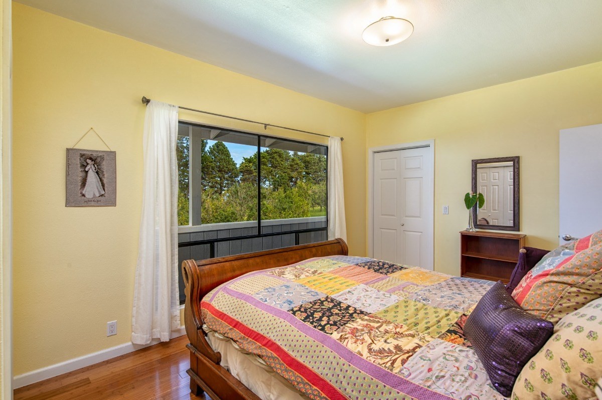 44-3265 Kalopa Mauka Road Honokaa, HI 96727 - Photo 16 of 30 a bedroom with a bed and a window