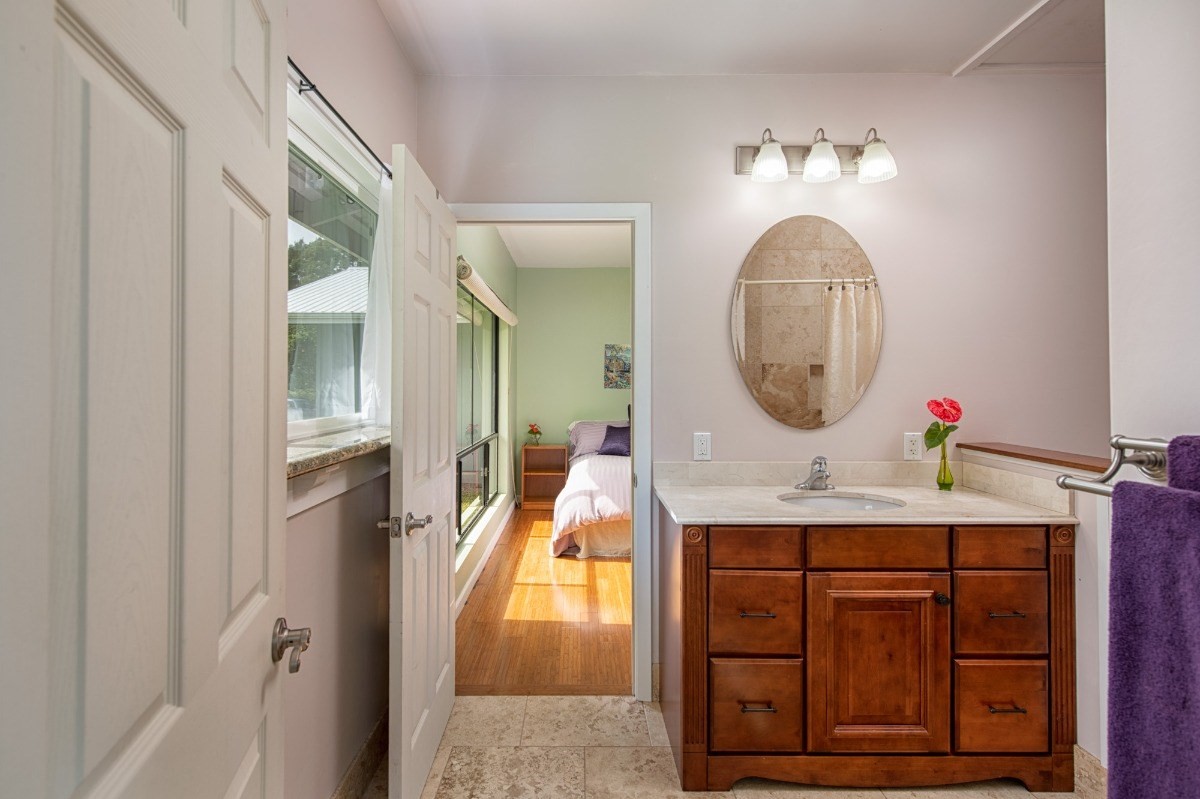 44-3265 Kalopa Mauka Road Honokaa, HI 96727 - Photo 18 of 30 a bathroom with a sink and a mirror