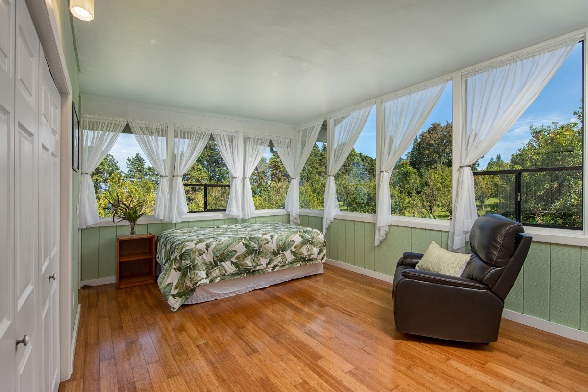 44-3265 Kalopa Mauka Road Honokaa, HI 96727 - Photo 22 of 30 a bedroom with furniture and windows