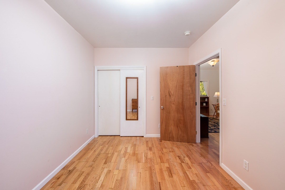 44-3265 Kalopa Mauka Road Honokaa, HI 96727 - Photo 25 of 30 a view of a room with wooden floor and stairs