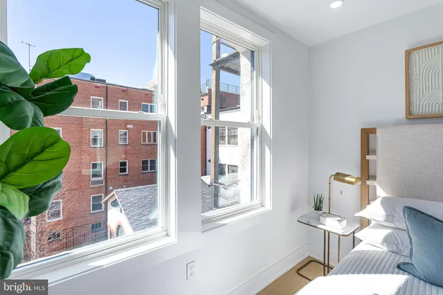 a vase of flowers sitting on a floor