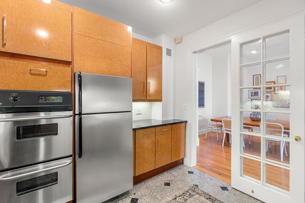 120 Beacon Street, Unit 3 Boston, MA 02116 - Photo 18 of 19 a kitchen with stainless steel appliances a refrigerator and a stove top oven