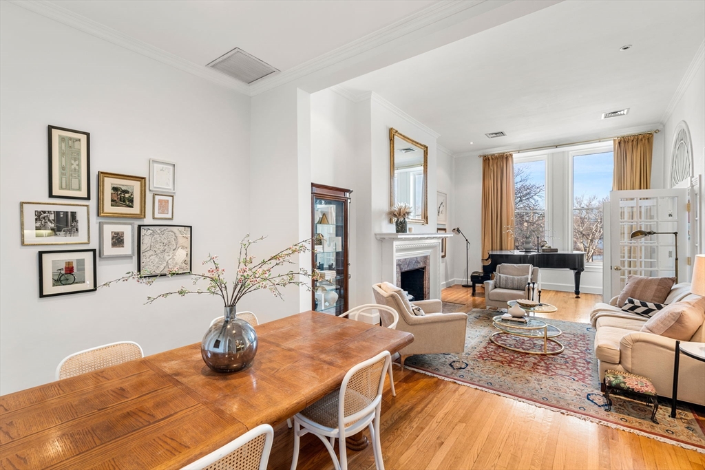 120 Beacon Street, Unit 3 Boston, MA 02116 - Photo 2 of 19 a dining room with furniture and a fireplace