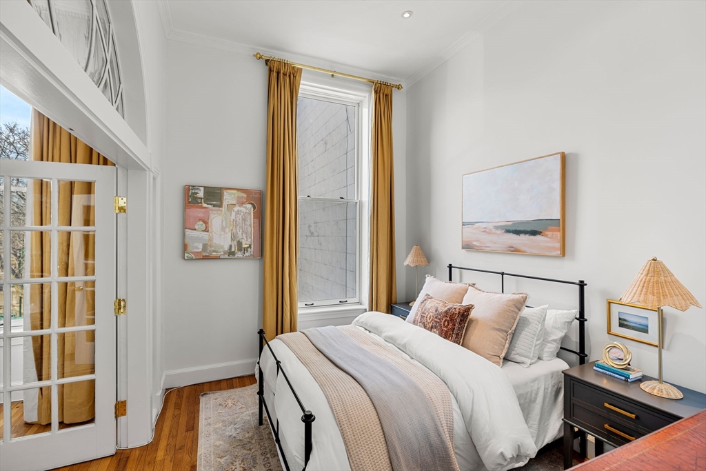 120 Beacon Street, Unit 3 Boston, MA 02116 - Photo 6 of 19 a bedroom with a bed and wooden floor