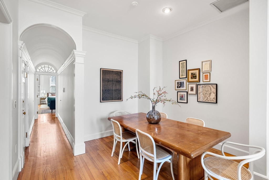 120 Beacon Street, Unit 3 Boston, MA 02116 - Photo 9 of 19 a view of a dining room with furniture and wooden floor