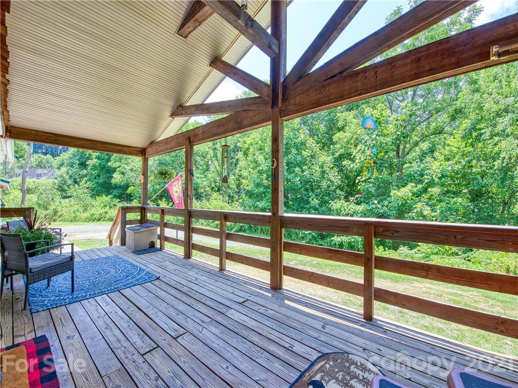 485 Loop Road Clyde, NC 28721 - Photo 3 of 33 a view of porch with wooden floor