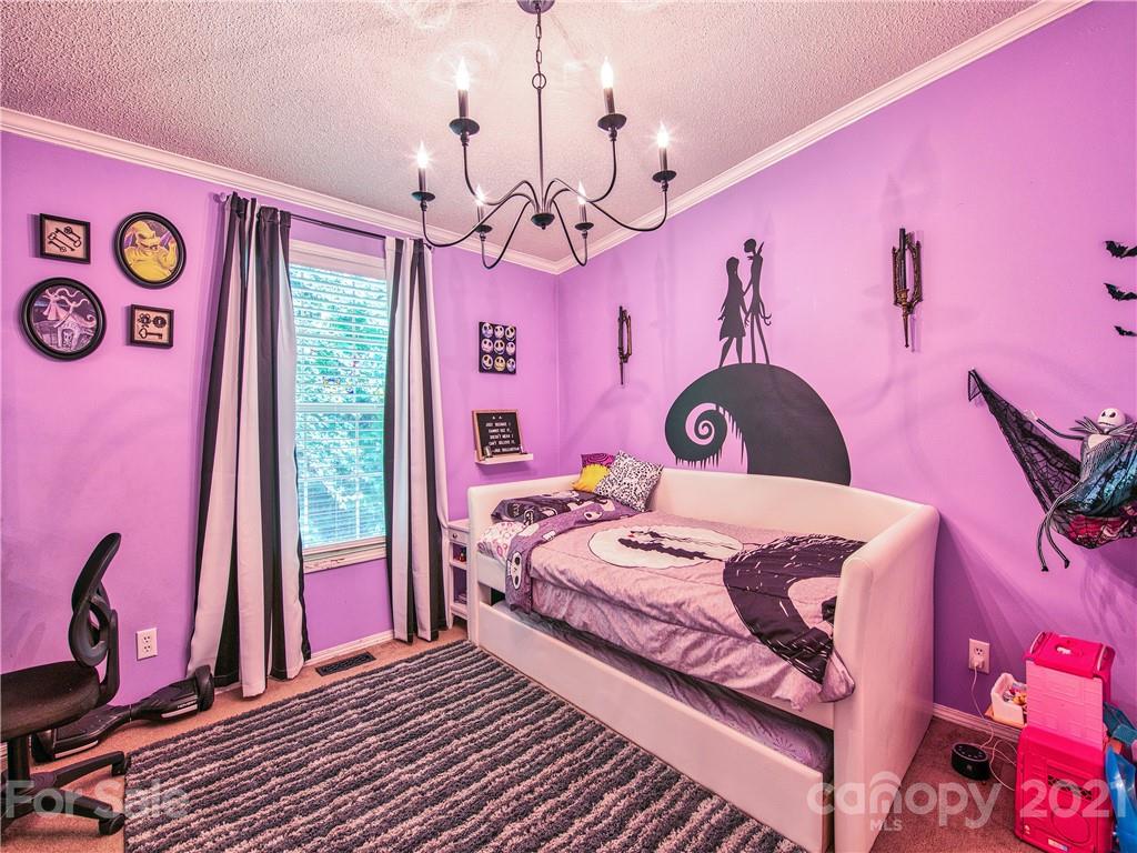 485 Loop Road Clyde, NC 28721 - Photo 22 of 33 a bedroom with a bed dresser and a window