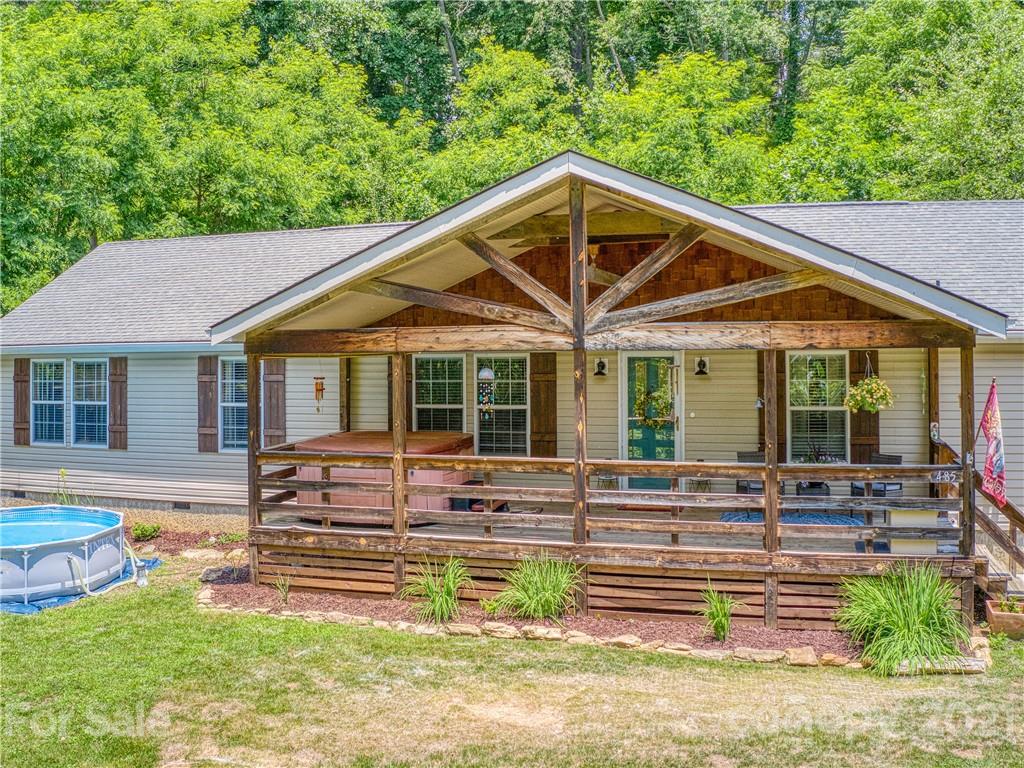 485 Loop Road Clyde, NC 28721 - Photo 29 of 33 a front view of a house with a yard table and chairs