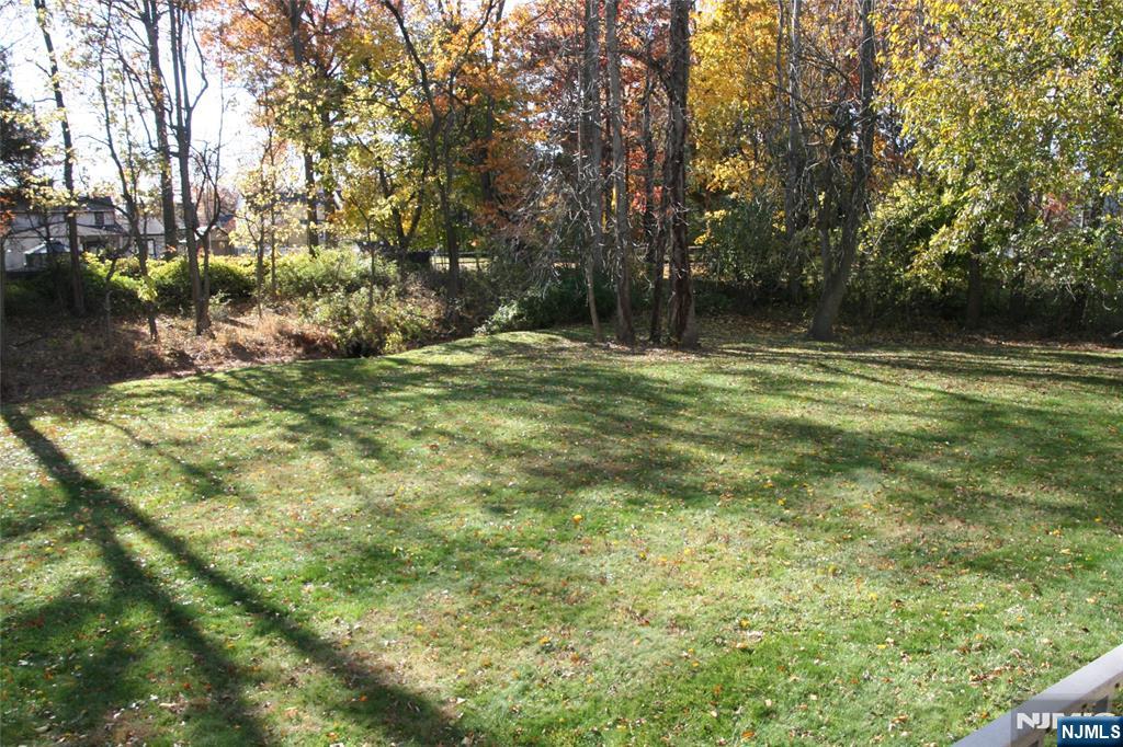 485 Saddle River Road, Unit 13 Saddle Brook, NJ 07663 - Photo 5 of 10 a backyard of a house with lots of green space